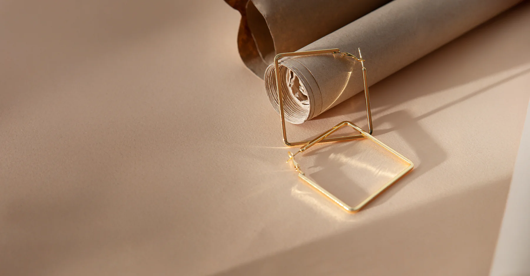 Gold earrings in warm light